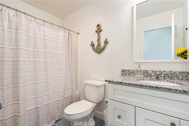 full bathroom with toilet, vanity, and shower / tub combo