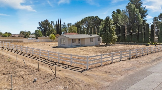 view of front of property featuring a rural view