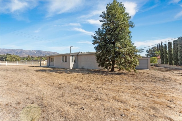 exterior space featuring a mountain view and a garage