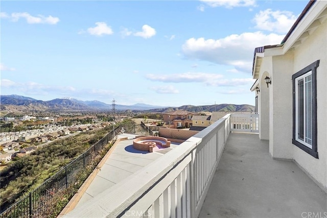 balcony featuring a mountain view