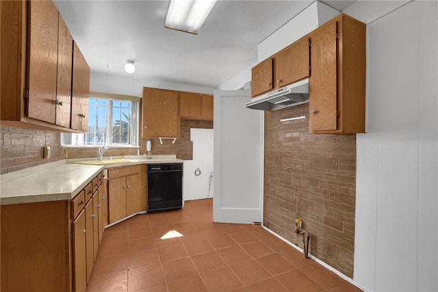 kitchen featuring decorative backsplash, sink, and black dishwasher