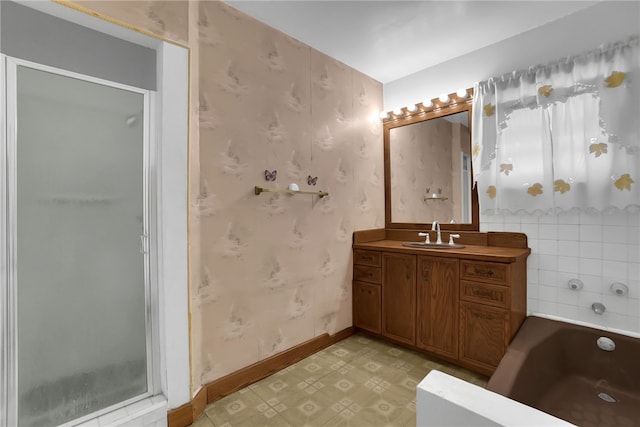 bathroom featuring vanity and a tub