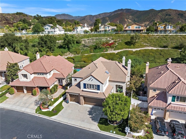 birds eye view of property with a mountain view