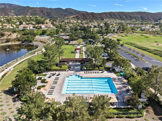 drone / aerial view featuring a water and mountain view