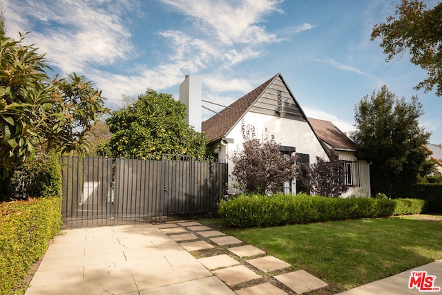 view of side of property featuring a yard