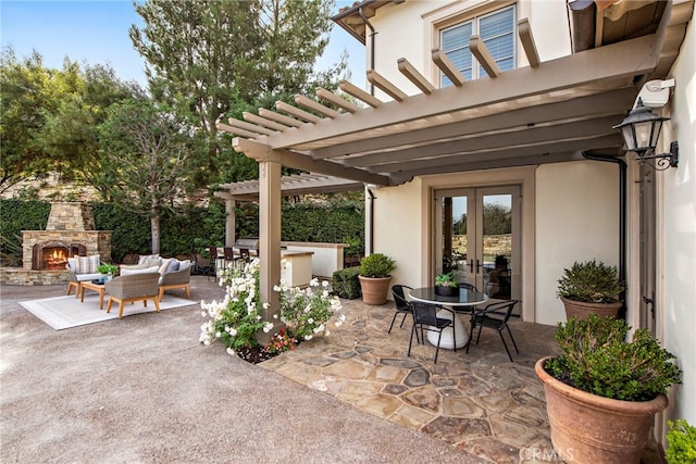 view of patio with an outdoor living space with a fireplace, french doors, and a pergola