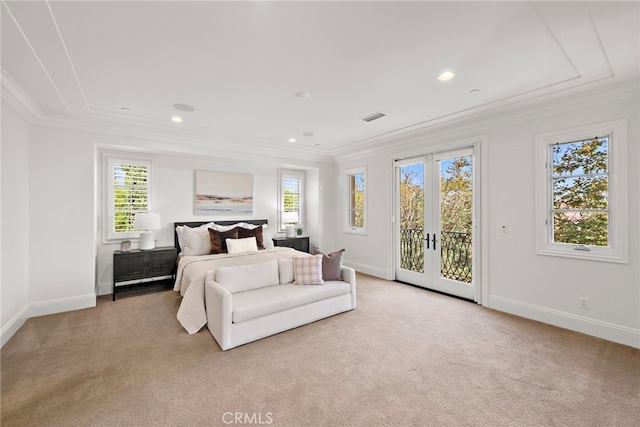 carpeted bedroom featuring access to exterior, french doors, multiple windows, and ornamental molding