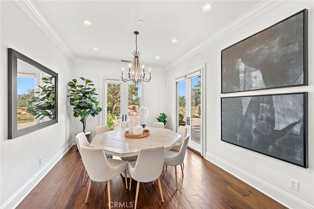 dining room featuring french doors, plenty of natural light, dark hardwood / wood-style floors, and ornamental molding