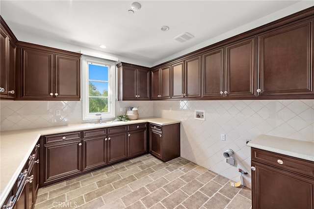 clothes washing area with cabinets, hookup for a washing machine, and hookup for a gas dryer