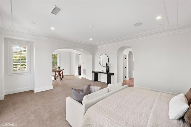 carpeted bedroom with ornamental molding