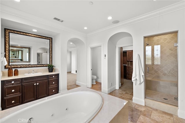 full bathroom featuring vanity, toilet, ornamental molding, and shower with separate bathtub