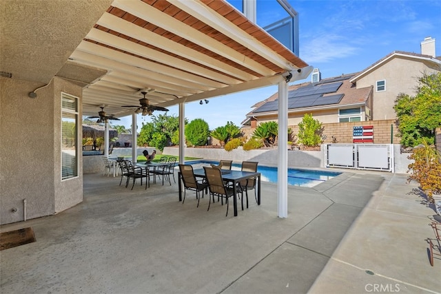 view of swimming pool with a patio and ceiling fan