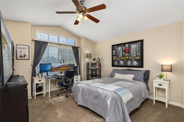 bedroom with dark colored carpet, lofted ceiling, and ceiling fan