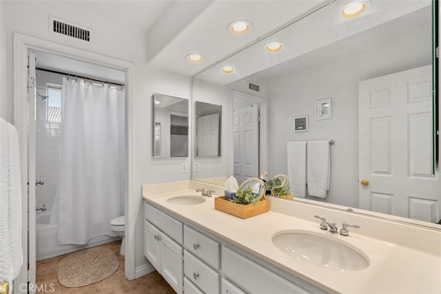 full bathroom featuring toilet, shower / tub combo with curtain, and vanity