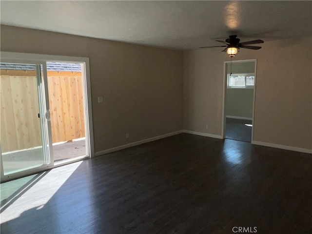 unfurnished room featuring ceiling fan and dark hardwood / wood-style flooring