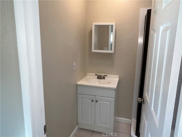 bathroom with tile patterned floors and vanity