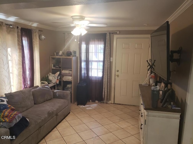 living area featuring light tile patterned flooring, ceiling fan, ornamental molding, and plenty of natural light