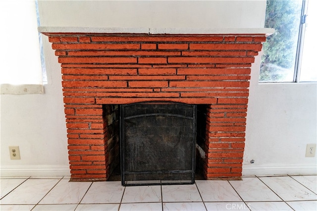 room details featuring a brick fireplace