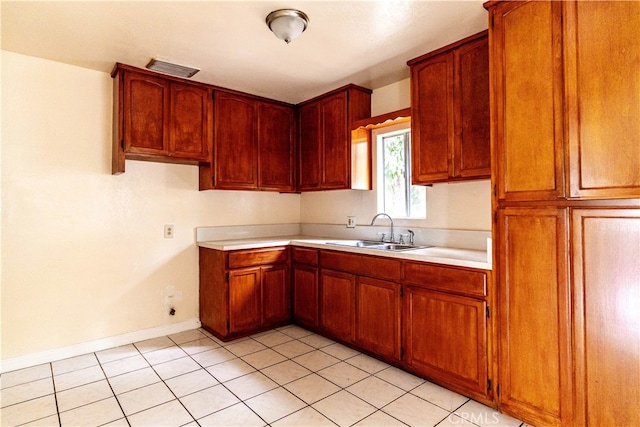 kitchen with sink and light tile patterned floors