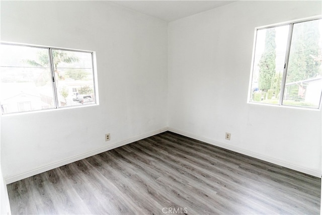 empty room with dark hardwood / wood-style floors