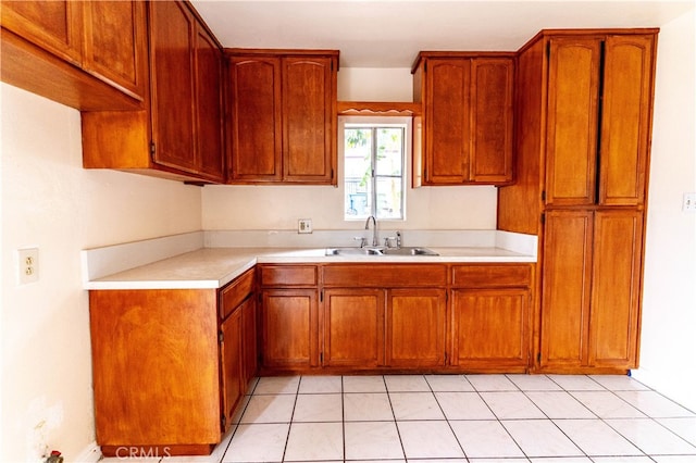 kitchen with sink and light tile patterned floors