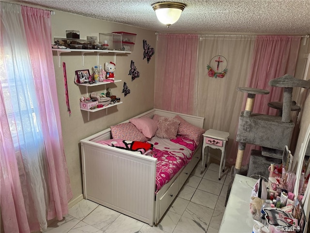 bedroom featuring a textured ceiling