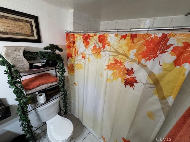 bathroom with toilet, a shower with curtain, and tile patterned flooring