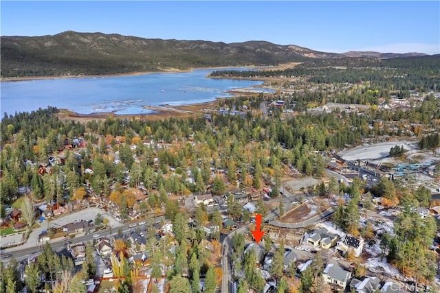 birds eye view of property featuring a water and mountain view