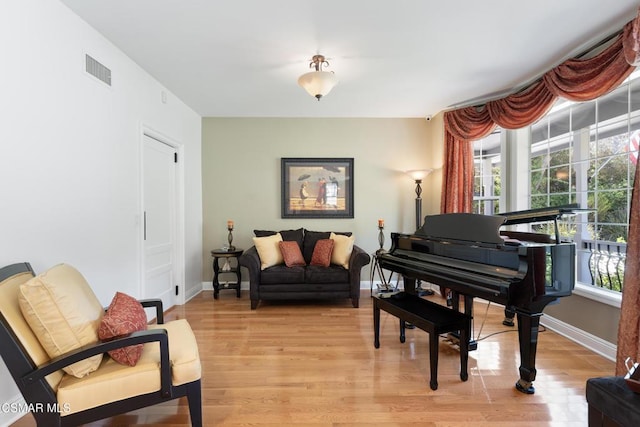 sitting room with light hardwood / wood-style flooring