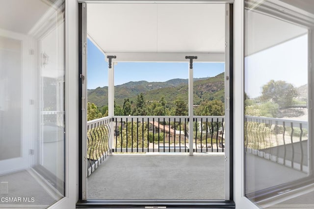 balcony featuring a mountain view