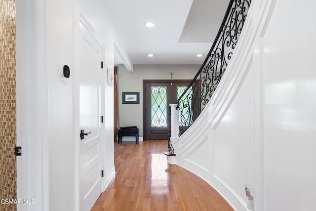 foyer with wood-type flooring