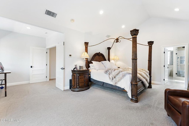 bedroom featuring lofted ceiling and light carpet