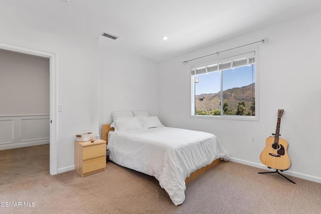 carpeted bedroom featuring a mountain view