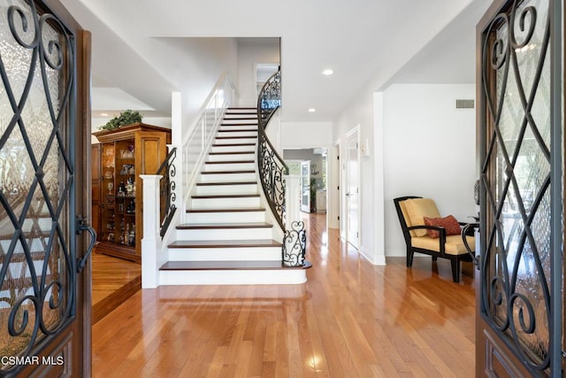 foyer entrance featuring plenty of natural light and light hardwood / wood-style floors