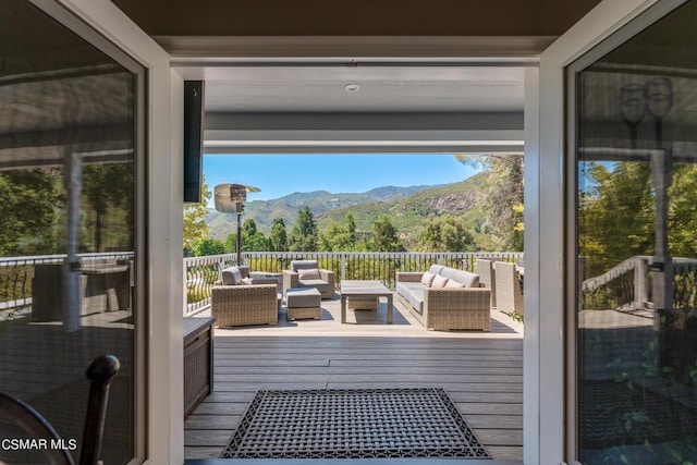 entryway featuring hardwood / wood-style floors and a mountain view