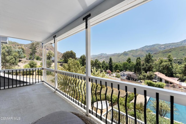 balcony featuring a mountain view