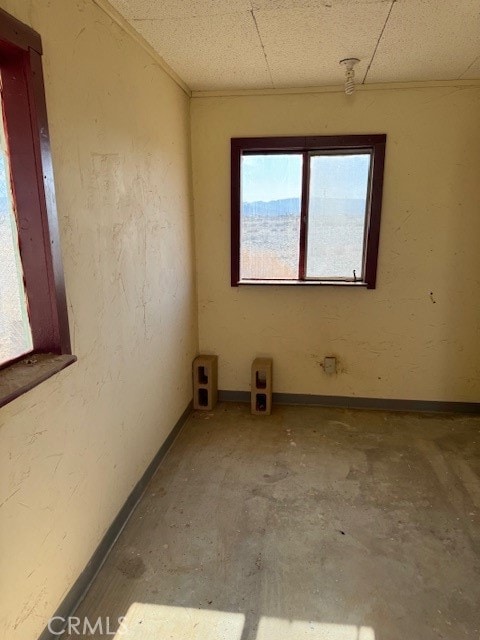 spare room with concrete flooring