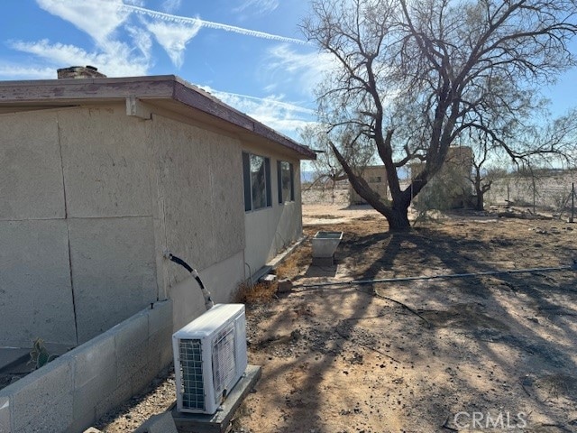 view of property exterior with ac unit