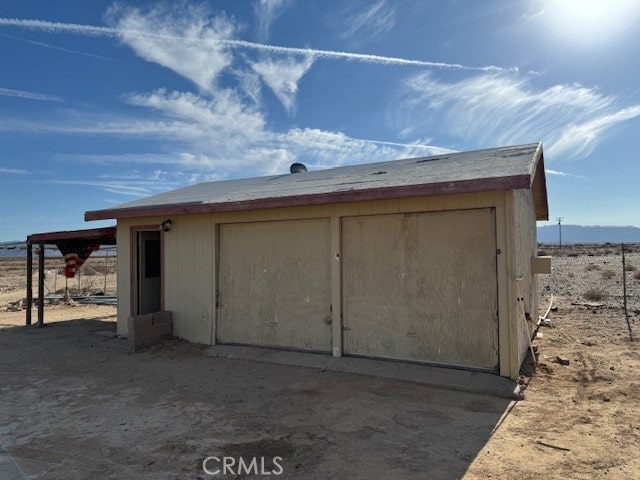 view of outbuilding with a garage