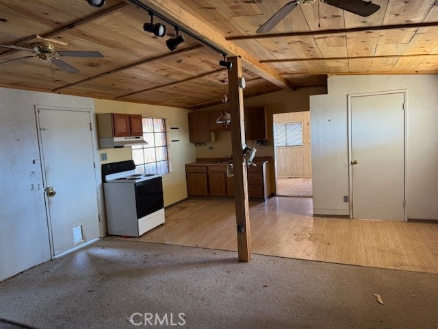 kitchen featuring lofted ceiling with beams, ceiling fan, light wood-type flooring, and electric stove