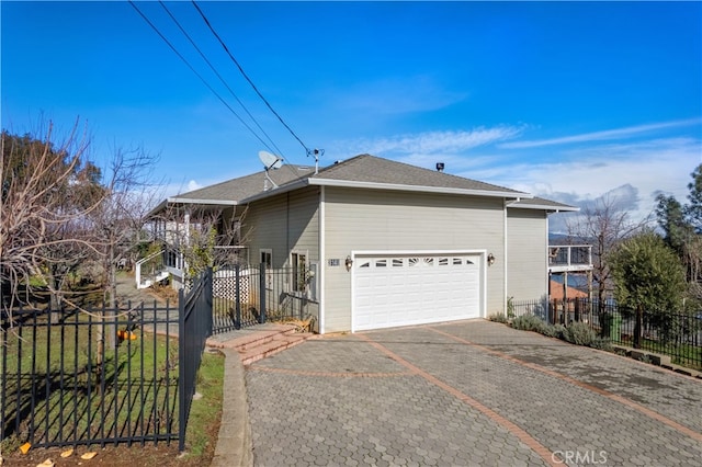 view of front of property with a garage