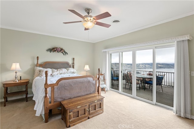 carpeted bedroom featuring ceiling fan, crown molding, and access to outside