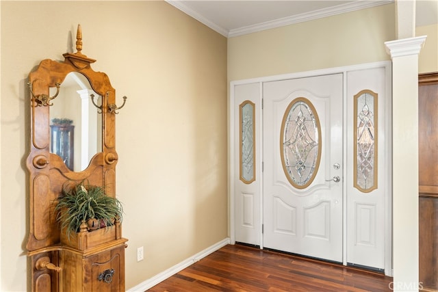 entrance foyer with ornate columns, ornamental molding, and dark hardwood / wood-style floors