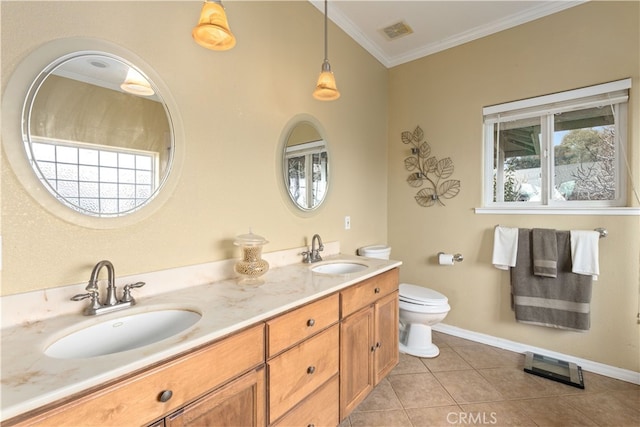 bathroom featuring vanity, crown molding, toilet, and tile patterned floors