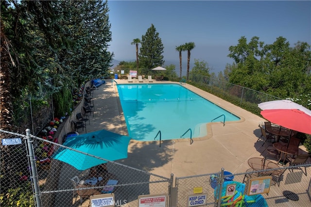 view of pool featuring a patio area