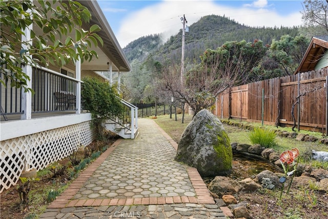 exterior space featuring a mountain view and a patio