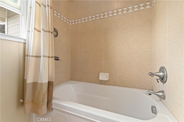 bathroom with shower / bath combo