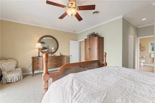 bedroom with ceiling fan, carpet flooring, ornamental molding, and ensuite bathroom