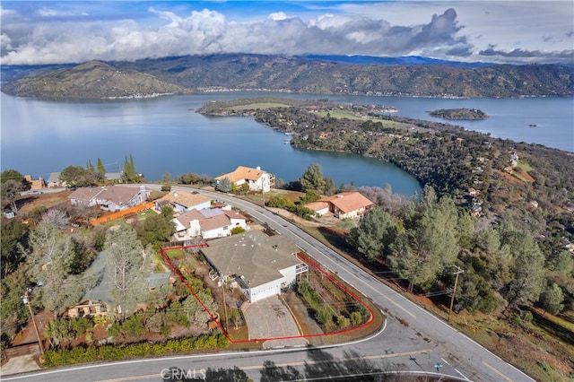 birds eye view of property featuring a water and mountain view