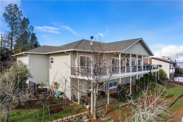 rear view of house with a balcony